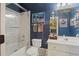 Well-lit bathroom featuring a shower, toilet, and vanity at 2016 Westbourne Way, Johns Creek, GA 30022
