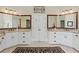 Luxurious bathroom featuring double vanities, granite countertops, and stylish mirrors at 2016 Westbourne Way, Johns Creek, GA 30022
