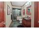 Well-lit bathroom with modern shower and dark stone tile floor at 2016 Westbourne Way, Johns Creek, GA 30022
