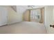 Minimalist bedroom with neutral carpet, light walls, and window for natural light at 2016 Westbourne Way, Johns Creek, GA 30022