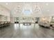 Spacious clubhouse with soaring ceilings, elegant chandeliers, a full bar, and ample seating for large gatherings at 2016 Westbourne Way, Johns Creek, GA 30022