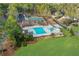 Aerial view of the community pool and recreation area with playground and tennis courts at 2016 Westbourne Way, Johns Creek, GA 30022