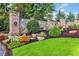 Stone and brick community entrance with manicured landscaping at 2016 Westbourne Way, Johns Creek, GA 30022