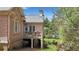 Brick home with exterior deck overlooking grassy yard at 2016 Westbourne Way, Johns Creek, GA 30022