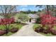 Charming single-story home with well-manicured lawn and a long driveway leading to the front entrance at 2016 Westbourne Way, Johns Creek, GA 30022