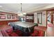 Open game room featuring a pool table, framed artwork, and hardwood flooring at 2016 Westbourne Way, Johns Creek, GA 30022
