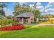Charming gate house with manicured lawn and colorful floral landscaping at 2016 Westbourne Way, Johns Creek, GA 30022