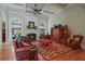Comfortable living room with a fireplace, wooden floors, and coffered ceilings at 2016 Westbourne Way, Johns Creek, GA 30022
