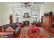 Comfortable living room with a fireplace, wooden floors, and coffered ceilings at 2016 Westbourne Way, Johns Creek, GA 30022