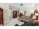 Comfortable main bedroom featuring plush carpet, ceiling fan, and a dresser with TV at 2016 Westbourne Way, Johns Creek, GA 30022