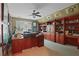 Spacious office with custom built-ins, desk space, and a neutral color palette at 2016 Westbourne Way, Johns Creek, GA 30022