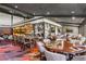 Upscale restaurant area featuring stylish seating, sports decor, and a well-stocked bar for an enjoyable dining experience at 2016 Westbourne Way, Johns Creek, GA 30022