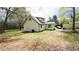 Expansive backyard featuring mature trees, room for outdoor activities, and potential for landscaping at 2638 Cleburne Pkwy, Powder Springs, GA 30127