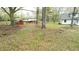 Extensive backyard with mature trees bordering fences and other residential structures at 2638 Cleburne Pkwy, Powder Springs, GA 30127