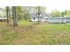 Large grassy backyard with mature trees and utility shed at 2638 Cleburne Pkwy, Powder Springs, GA 30127