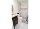 Modern bathroom with granite countertop, sleek vanity, and a tile shower, creating a spa-like experience at 2638 Cleburne Pkwy, Powder Springs, GA 30127
