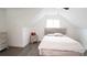 This bedroom features light wood floors, a dresser with a mirror, and a modern bed frame at 2638 Cleburne Pkwy, Powder Springs, GA 30127