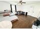 Spacious bedroom with hardwood floors, a window view, and a casual seating area at 2638 Cleburne Pkwy, Powder Springs, GA 30127