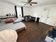 Spacious bedroom featuring dark hardwood floors, ceiling fan and a double bed at 2638 Cleburne Pkwy, Powder Springs, GA 30127