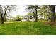 Beautiful two-story home surrounded by a large front lawn with mature trees and classic design at 2638 Cleburne Pkwy, Powder Springs, GA 30127
