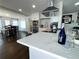 Elegant kitchen featuring sleek countertops, stainless steel appliances, and an open layout with a view to the dining area at 2638 Cleburne Pkwy, Powder Springs, GA 30127