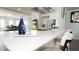 Bright kitchen showcasing a white marble island with modern stainless steel appliances and barstool seating at 2638 Cleburne Pkwy, Powder Springs, GA 30127
