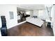 Bright living room featuring hardwood floors and white walls at 2638 Cleburne Pkwy, Powder Springs, GA 30127