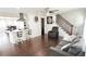 Inviting living room with hardwood floors, comfortable seating, and staircase at 2638 Cleburne Pkwy, Powder Springs, GA 30127