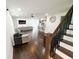 Open-concept living room featuring hardwood floors and a comfortable gray couch at 2638 Cleburne Pkwy, Powder Springs, GA 30127