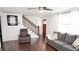 Cozy living room features hardwood floors, comfortable seating, and natural light at 2638 Cleburne Pkwy, Powder Springs, GA 30127