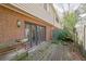 Fenced back patio area with double doors leading into the home at 3312 Northcrest Rd # C, Atlanta, GA 30340