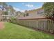 Spacious backyard with a lush lawn and a wooden fence providing privacy at 3312 Northcrest Rd # C, Atlanta, GA 30340