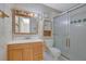 Bathroom with glass enclosed shower and a wooden vanity with mirror at 3312 Northcrest Rd # C, Atlanta, GA 30340