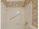 Bathroom featuring a shower over the tub with white tiling and patterned wallpaper at 3312 Northcrest Rd # C, Atlanta, GA 30340