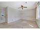 Bedroom with a ceiling fan and window offering natural light at 3312 Northcrest Rd # C, Atlanta, GA 30340