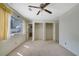 Bedroom with a ceiling fan, closet, and window, offering space and natural light at 3312 Northcrest Rd # C, Atlanta, GA 30340