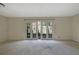Spacious living room with a large window providing natural light and access to the outdoors at 3312 Northcrest Rd # C, Atlanta, GA 30340