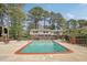 Neighborhood pool with lounge chairs and mature landscaping at 3312 Northcrest Rd # C, Atlanta, GA 30340