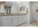 Bright bathroom with a white vanity, granite countertop, and a well-lit mirror at 3689 Essex Ave # 16, Atlanta, GA 30339