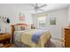 Cozy bedroom with neutral walls, soft carpet, and a comfortable bed, complemented by natural light from the window at 3689 Essex Ave # 16, Atlanta, GA 30339