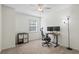 Bright bedroom with neutral walls, soft carpet, and a dedicated workspace with a desk and comfortable chair at 3689 Essex Ave # 16, Atlanta, GA 30339