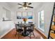 Elegant dining room featuring a round table, stylish chairs, and serene artwork at 3689 Essex Ave # 16, Atlanta, GA 30339
