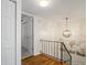 Hallway featuring wood floors, neutral paint and access to stairway and doorways, complemented by unique decor at 3689 Essex Ave # 16, Atlanta, GA 30339