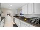 Bright kitchen with white cabinets, stainless steel appliances, and granite countertops at 3689 Essex Ave # 16, Atlanta, GA 30339