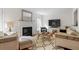 Cozy living room with fireplace, plush seating, and a stylish woven coffee table at 3689 Essex Ave # 16, Atlanta, GA 30339