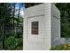 Essex House community entrance sign, white brick with a black metal sign at 3689 Essex Ave # 16, Atlanta, GA 30339