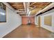Unfinished basement area offers exposed ceiling, equipment, and concrete floor for customization at 4650 Riversound Dr, Snellville, GA 30039