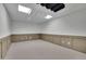 Finished basement featuring carpeting, and modern wainscotting at 4650 Riversound Dr, Snellville, GA 30039