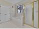 Bathroom showcasing a tub, shower, and tiled flooring, perfect for relaxation at 4650 Riversound Dr, Snellville, GA 30039