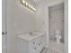 Bathroom featuring a vanity, mirror, and tiled flooring, enhancing the home's comfort at 4650 Riversound Dr, Snellville, GA 30039